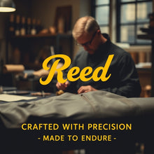 Load image into Gallery viewer, Person working on a leather jacket with 'Reed' branding and text 'Crafted with precision, made to endure'.