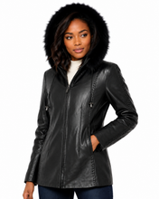 Load image into Gallery viewer, Woman wearing a black leather jacket with fur hood on a white background