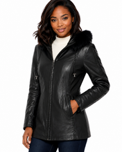 Load image into Gallery viewer, Woman wearing a black leather jacket with fur hood on a white background