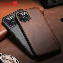 Load image into Gallery viewer, Luxury hybrid protective leather iPhone case with premium PU leather and TPU frame, in brown and black variations on a wooden surface.