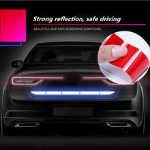 Load image into Gallery viewer, Car with reflective tape for enhanced safety and visibility on the road, featuring red-stripe detail in close-up view.