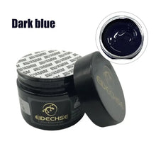 Load image into Gallery viewer, Dark blue leather vinyl repair kit jar with open lid, showing the color and texture of the repair cream inside.