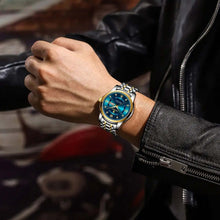 Cargar imagen en el visor de la galería, Luxury men's watch with blue dial on a man's wrist, exuding elegance and style, perfect for a sophisticated and successful look.