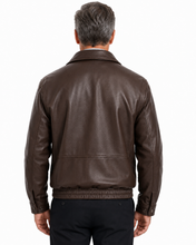 Charger l'image dans la galerie, A man wearing a Back of Reed leather jacket made in USA over a black button-down shirt, photographed against a plain white studio background.