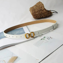Cargar imagen en el visor de la galería, Elegant leather designer belt for women with gold buckle displayed on magazine, perfect for adding sophistication and style.