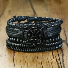 Load image into Gallery viewer, Braided wrap black leather bracelets with nautical wheel design on wooden background