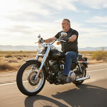 Load image into Gallery viewer, Man riding a motorcycle on a desert road with a clear sky.