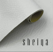 Load image into Gallery viewer, Close-up of rolled white textured leather with logo, ideal for repairing and restoring luxury leather items.