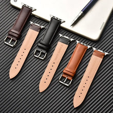 Charger l'image dans la galerie, Elegant brown leather bands for Apple Watch displayed on dark surface, showcasing premium quality and style for Series 1-5 in multiple sizes.