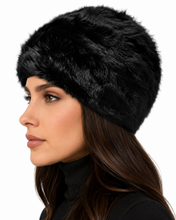 Charger l'image dans la galerie, A close-up side profile of a woman wearing a black faux fur hat against a plain white background.