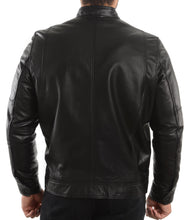Load image into Gallery viewer, A man viewed from the back wearing a black leather jacket and black pants against a plain white studio background.