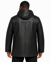 Charger l'image dans la galerie, A man viewed from the back wearing a black textured leather hooded jacket against a plain white background.