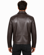 Charger l'image dans la galerie, A man viewed from the back wearing a dark brown leather jacket and black jeans against a plain white background.