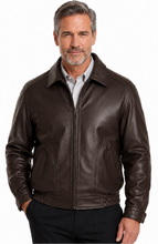 Charger l'image dans la galerie, A man wearing a Reed Brown leather jacket made in USA over a black button-down shirt, photographed against a plain white studio background.