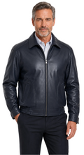 Charger l'image dans la galerie, A man wearing a Reed navy leather jacket made in USA over a black button-down shirt, photographed against a plain white studio background.