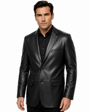 Charger l'image dans la galerie, A man wearing a black leather blazer over a black button-down shirt, photographed against a plain white studio background.