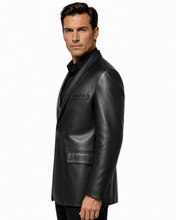 Charger l'image dans la galerie, A man wearing a black leather blazer over a black shirt, shown in profile against a plain white studio background.