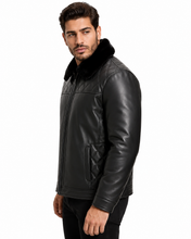 Cargar imagen en el visor de la galería, A man wearing a black leather jacket with a black faux-fur collar, shown in a side profile against a plain white background.