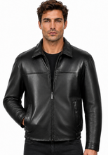 Charger l'image dans la galerie, A man wearing a black leather jacket with a front zipper, collar, and zippered chest pockets, paired with a black shirt and black jeans, against a plain white background.