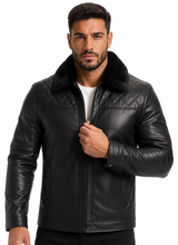 Cargar imagen en el visor de la galería, A man wearing a black leather jacket with a plush black fur collar, posing against a solid white background.