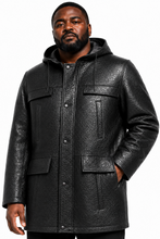 Charger l'image dans la galerie, A man wearing a black textured faux-leather hooded jacket with snap-button front, chest flap pockets, and lower patch pockets, photographed against a plain white background.