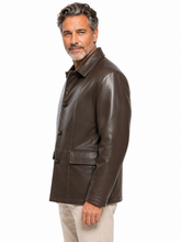 Cargar imagen en el visor de la galería, A man wearing a dark brown leather jacket and beige pants, shown in a side profile against a plain white background.