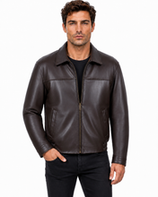 Charger l'image dans la galerie, A man wearing a dark brown leather jacket over a black shirt and black pants, standing against a plain white background.