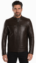 Load image into Gallery viewer, A man wearing a dark brown leather jacket with a front zipper and zippered chest pockets, paired with black pants, photographed against a plain white studio background.