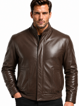Load image into Gallery viewer, A man wearing a dark brown leather jacket with a stand-up collar, front zipper, and two front flap pockets, paired with black pants, against a plain white background.