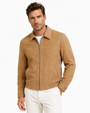 Charger l'image dans la galerie, A man wearing a tan suede zip-up jacket over a white t-shirt and white pants, photographed against a clean white background.