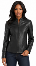 Cargar imagen en el visor de la galería, A woman modeling a black real-leather jacket with a full zipper and stand collar, paired with dark blue jeans, against a plain white background.