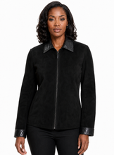 Cargar imagen en el visor de la galería, A woman modeling a black suede jacket with black real-leather trim on the collar, cuffs, and front zipper, set against a plain white background.