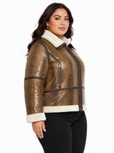 Cargar imagen en el visor de la galería, A woman modeling a cropped metallic snakeskin jacket with a white faux-fur collar, cuffs, and hem, paired with black pants against a plain white background.
