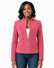 Cargar imagen en el visor de la galería, A woman modeling a pink zip-up jacket with a stand collar, paired with a white top and blue jeans, against a plain white background.