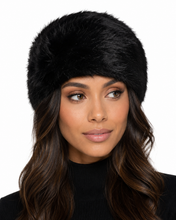 Charger l'image dans la galerie, A woman wearing a black faux fur hat, shown from the chest up against a plain white background.