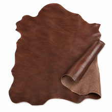 Cargar imagen en el visor de la galería, Antique Brown leather hide with a rolled-up piece on a white background