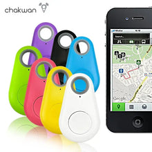 Cargar imagen en el visor de la galería, Colorful key GPS tracker devices next to smartphone mapping app display.