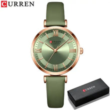 Load image into Gallery viewer, Green leather strap wristwatch with gold accents featuring a classic clockface design, shown with branded box. Stylish and water-resistant.