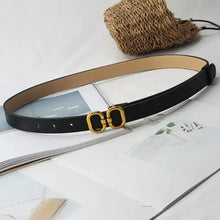 Cargar imagen en el visor de la galería, Elegant leather designer belt for women with a gold buckle, crafted from high-quality leather, shown on a magazine layout.