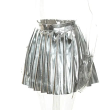 Cargar imagen en el visor de la galería, Chic pleated faux leather mini skirt in metallic silver, perfect for adding style and elegance to any outfit.