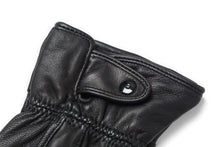 Load image into Gallery viewer, Close-up of black genuine leather driving gloves with button detail, warm lined for cold weather, touchscreen compatible.
