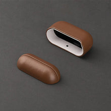 Load image into Gallery viewer, Brown genuine leather AirPods case on dark background, showcasing durable protection and stylish design.