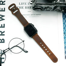 Load image into Gallery viewer, Elegant leather band watch displayed on a magazine with a vintage camera and glasses nearby, showcasing timeless sophistication.