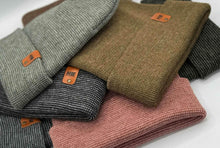 Charger l'image dans la galerie, Pile of HAAKWEAR Classic Fusion Cuffed Beanie - Gray / Green, Made in USA showcasing various colors, including gray and green.
