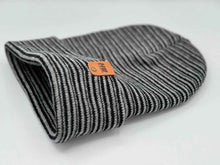 Load image into Gallery viewer, HAAKWEAR Traditional Contrast Cuffed Beanie/ Hat - Black / Gray, Made in USA, shown folded with striped pattern and logo.
