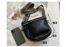 Load image into Gallery viewer, Vintage vegan leather crossbody shoulder bag with adjustable striped strap and classic design, displayed with phone and rings.