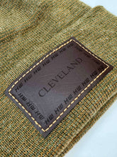 Charger l'image dans la galerie, Close-up of Haakwear Cleveland H Stitch Cuffed Beanie patch in Brown / Green Fusion, showcasing quality craftsmanship. Made in USA Hats.