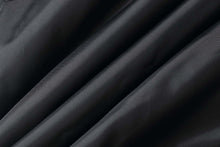 Load image into Gallery viewer, Close-up of smooth, black leather texture showcasing the quality material of the REED Men's Aviator Bomber Jacket.