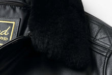 Load image into Gallery viewer, Close-up of REED Men's Premium Leather Aviator Bomber Jacket detailing, showcasing soft black leather and fur collar.