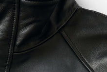 Load image into Gallery viewer, Close-up of black leather, possibly from a luxury car coat with soft texture, emphasizing its quality and elegance.